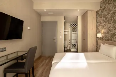 Cama o camas de una habitación en Hotel Avenida Gran Vía