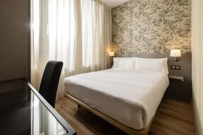 Cama o camas de una habitación en Hotel Avenida Gran Vía