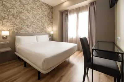 Cama o camas de una habitación en Hotel Avenida Gran Vía