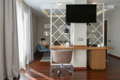 Una televisión o centro de entretenimiento en Vincci Soma