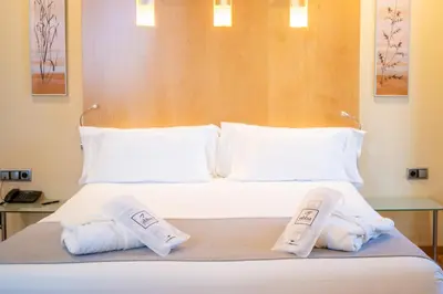 Cama o camas de una habitación en Abba Madrid