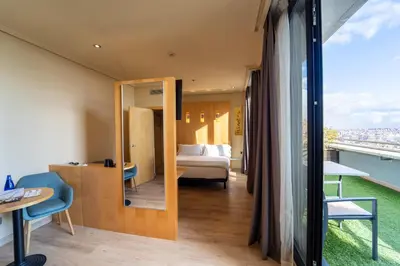 Cama o camas de una habitación en Abba Madrid