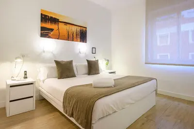 Cama o camas de una habitación en NeoMagna Madrid