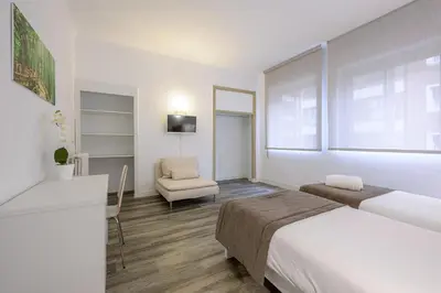 Cama o camas de una habitación en NeoMagna Madrid