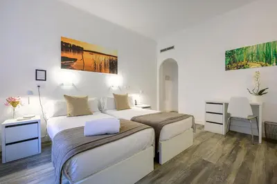 Cama o camas de una habitación en NeoMagna Madrid