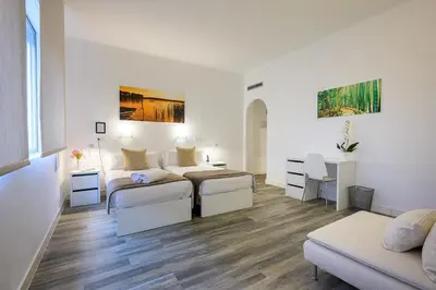 Cama o camas de una habitación en NeoMagna Madrid