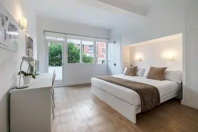 Cama o camas de una habitación en NeoMagna Madrid