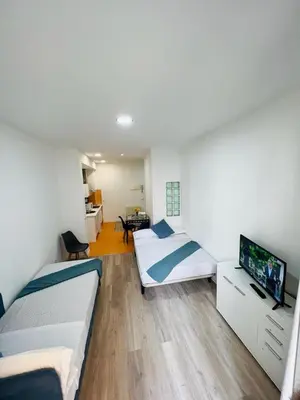 Cama o camas de una habitación en ESTUDIOS RUDA 4