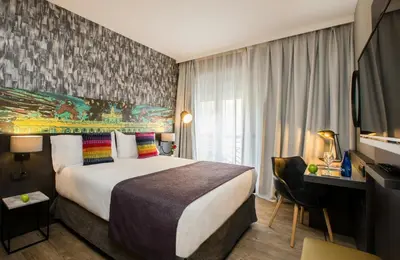 Cama o camas de una habitación en Leonardo Boutique Hotel Madrid