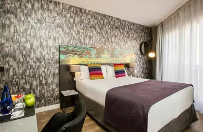 Cama o camas de una habitación en Leonardo Boutique Hotel Madrid