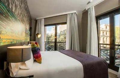 Cama o camas de una habitación en Leonardo Boutique Hotel Madrid