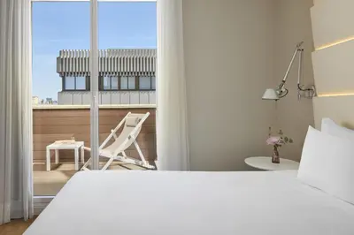 Cama o camas de una habitación en NH Madrid Balboa