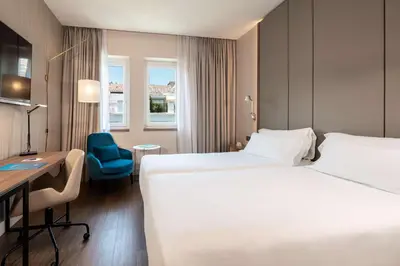 Cama o camas de una habitación en NH Madrid Lagasca