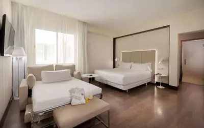 Cama o camas de una habitación en NH Madrid Lagasca