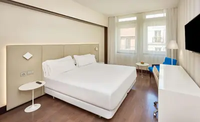 Cama o camas de una habitación en NH Madrid Lagasca