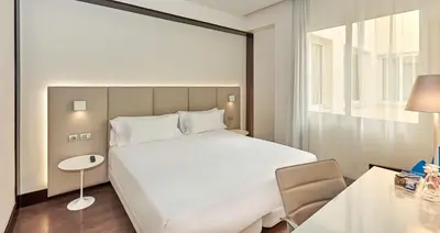 Cama o camas de una habitación en NH Madrid Lagasca