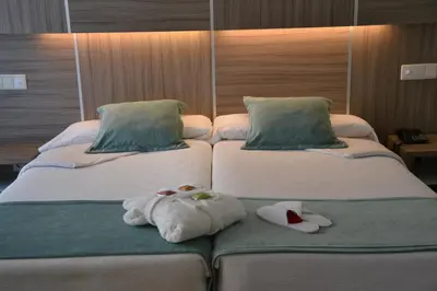 Cama o camas de una habitación en Hotel Serrano