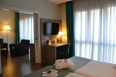 Cama o camas de una habitación en Hotel Serrano