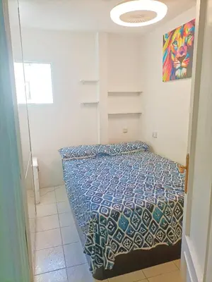 Cama o camas de una habitación en HABITACION EN CHUECA, CENTRO DE MADRID