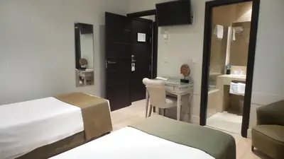 Cama o camas de una habitación en Hotel Moderno Puerta del Sol