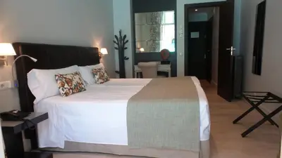 Cama o camas de una habitación en Hotel Moderno Puerta del Sol