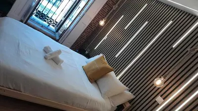 Cama o camas de una habitación en Apartamentos Preciados