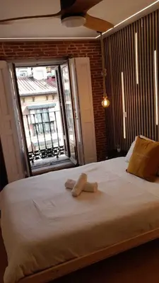 Cama o camas de una habitación en Apartamentos Preciados