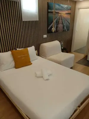 Cama o camas de una habitación en Apartamentos Preciados