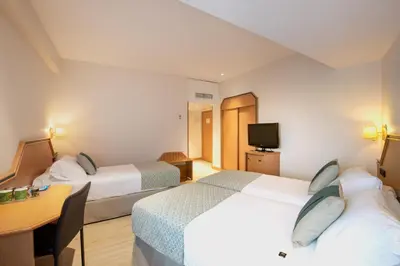 Cama o camas de una habitación en Hotel Praga