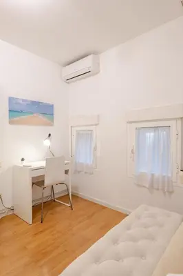 Cama o camas de una habitación en MAD COCO Aparts & Suites Sol