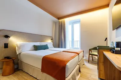 Cama o camas de una habitación en Petit Palace Puerta del Sol