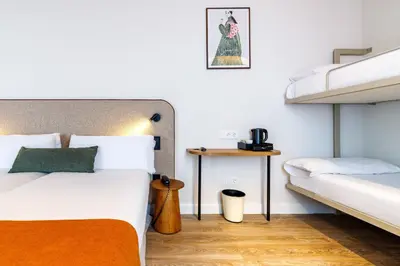 Cama o camas de una habitación en Petit Palace Puerta del Sol
