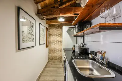 Una cocina o zona de cocina en Apartamento Plaza de España 11