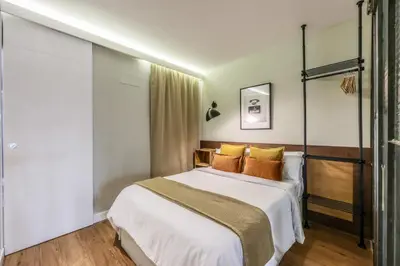 Cama o camas de una habitación en AmazINN Collection Madrid Chueca