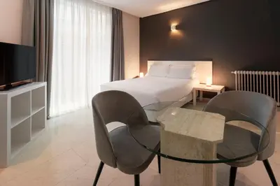 Cama o camas de una habitación en Sercotel Togumar