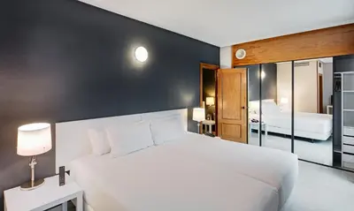 Cama o camas de una habitación en Sercotel Togumar