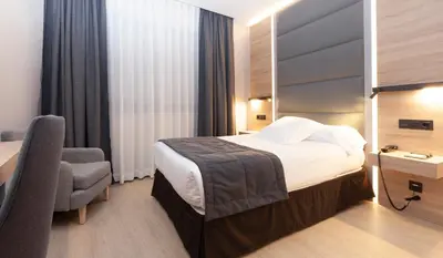 Cama o camas de una habitación en Hotel Liabeny