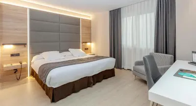 Cama o camas de una habitación en Hotel Liabeny