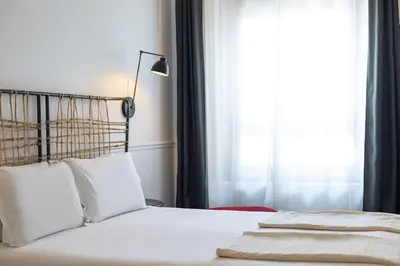 Cama o camas de una habitación en 7 Islas Hotel