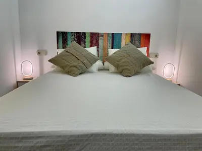 Cama o camas de una habitación en Madrid Villa Suites Serenidad