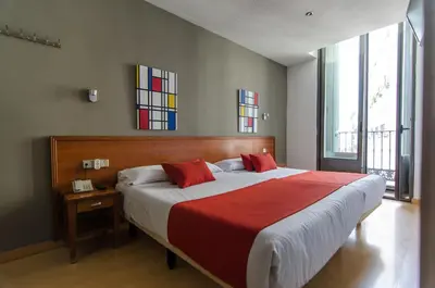 Cama o camas de una habitación en Hostal Persal