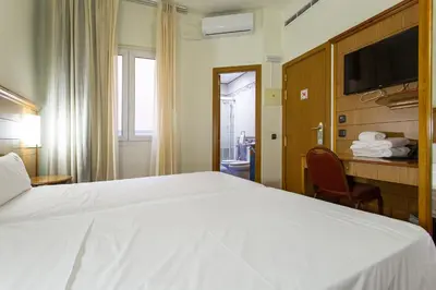 Cama o camas de una habitación en Negresco Gran Via