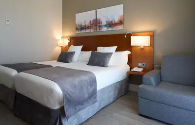 Cama o camas de una habitación en Hotel Puerta de Toledo