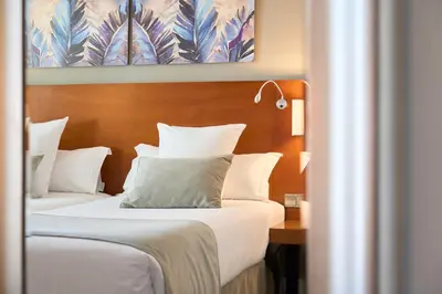 Cama o camas de una habitación en Hotel Puerta de Toledo