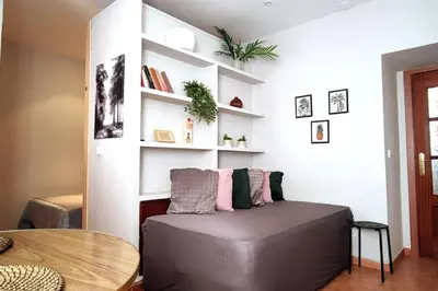 Cama o camas de una habitación en Estudio Lavapiés cerca de Antón Martín