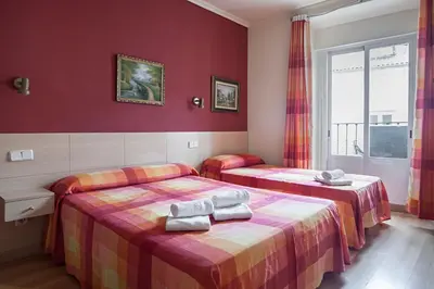 Cama o camas de una habitación en Hostal Inter Plaza Mayor AUTO CHECK IN
