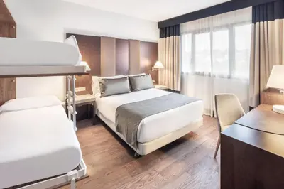 Cama o camas de una habitación en Catalonia El Retiro