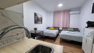 Cama o camas de una habitación en Estudio Madrid Centro MALASAÑA