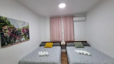 Cama o camas de una habitación en Estudio Madrid Centro MALASAÑA