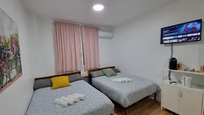 Cama o camas de una habitación en Estudio Madrid Centro MALASAÑA